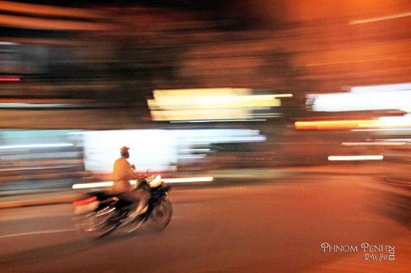 Zooming past Phnom Penh on a Bike